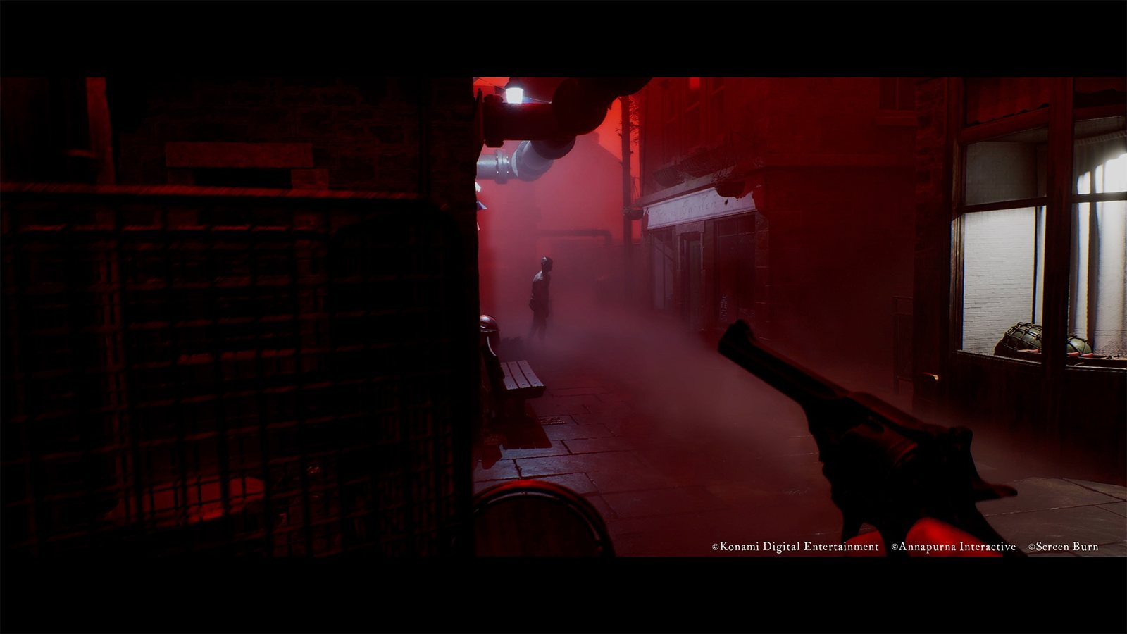 First-person view of a revolver aimed down a red-lit street at an enemy
